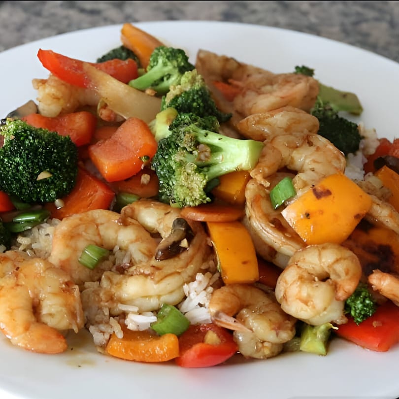 Bo Loong's shrimp stir-fry with broccoli, bell peppers, and carrots over rice.